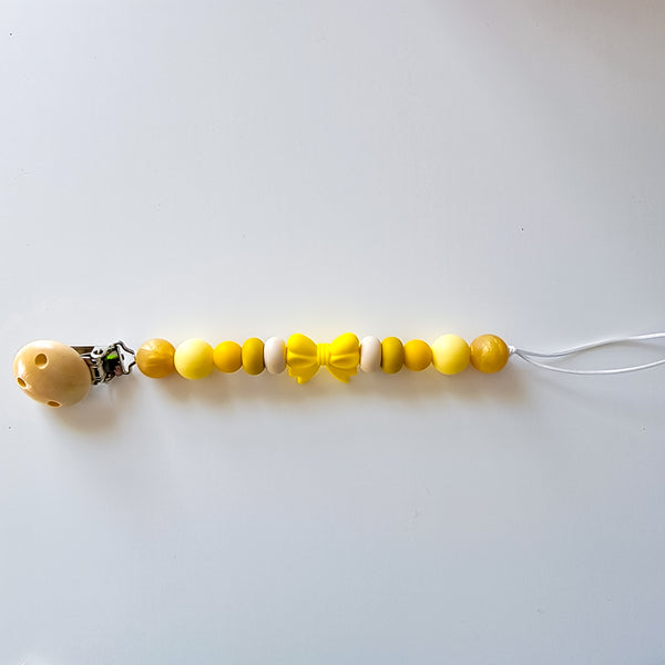 Shades of yellow pacifier clip