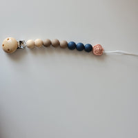 Neutral pacifier clip with flower