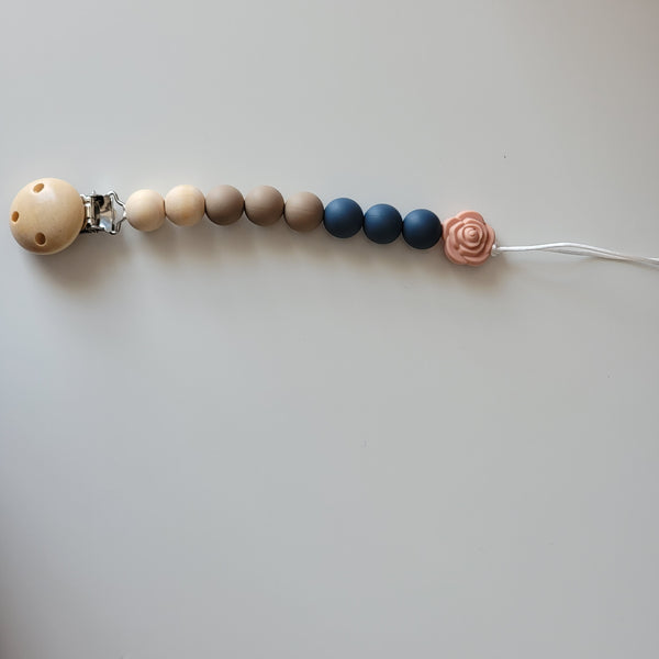 Neutral pacifier clip with flower